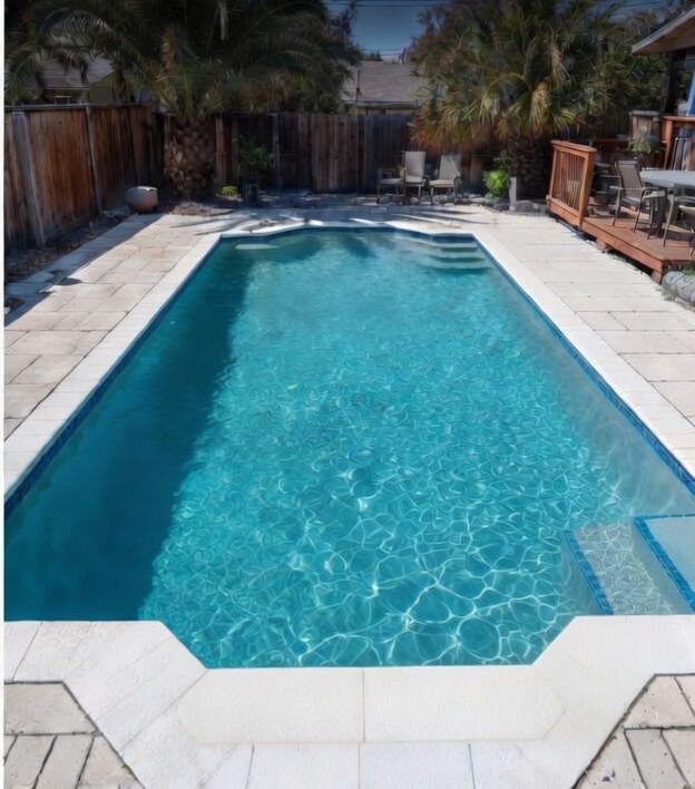 Crystal clear backyard pool after Paradise Pools service